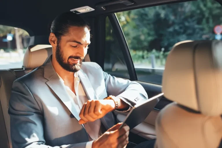 About us 1 Businessman in a central taxis car